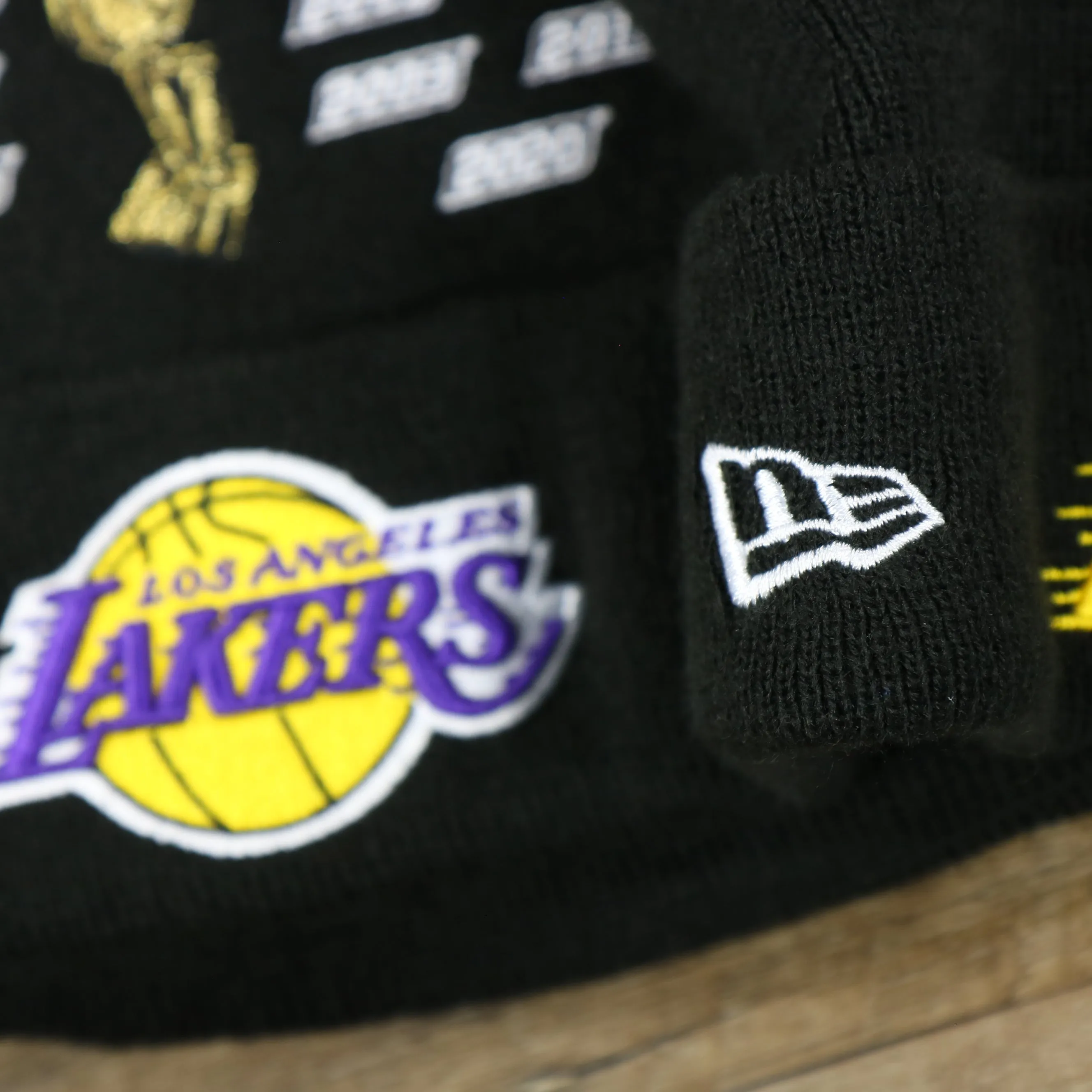 Los Angeles Lakers All Over NBA Finals Side Patch 17x Champion Knit Cuff Beanie | New Era, Black